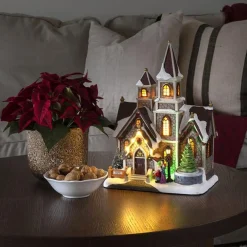 Hus med roterende juletre og musikk LED